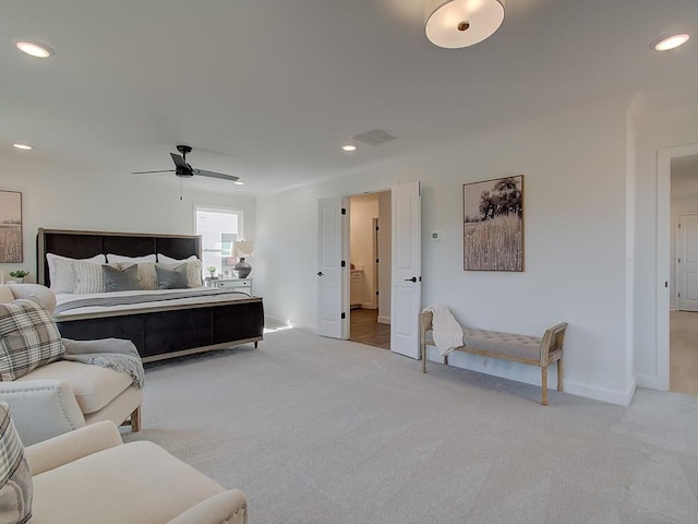 bedroom featuring light carpet and ceiling fan