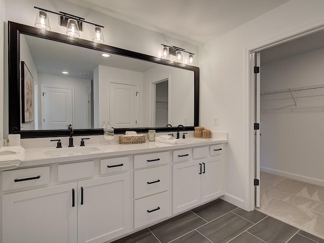 107 Winsome Way, Woodstock, GA 30188 - full bath featuring double vanity, baseboards, a spacious closet, and a sink