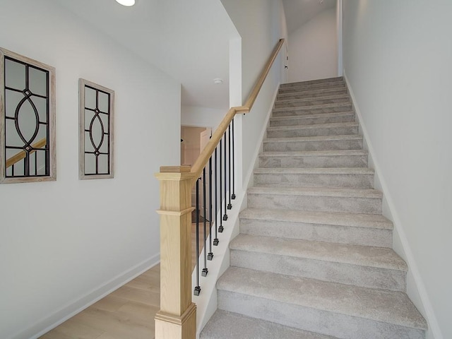 stairway featuring hardwood / wood-style floors