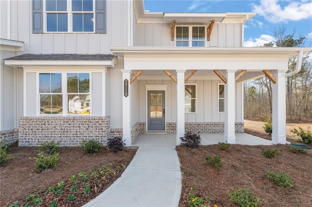 2719 Byess Ct, Marietta, GA 30064 - entrance to property featuring board and batten siding, a porch, and brick siding