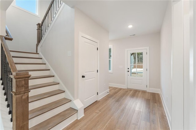 2719 Byess Ct, Marietta, GA 30064 - entryway featuring light wood-style floors, stairs, recessed lighting, and baseboards