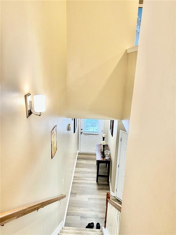 2691 Pointcrest Way, Grayson, GA 30017 - stairway with wood finished floors and a high ceiling