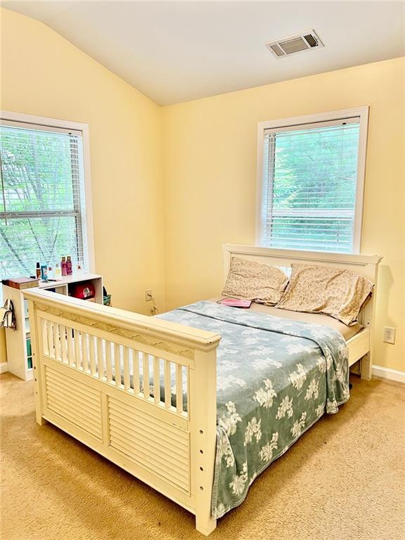 2691 Pointcrest Way, Grayson, GA 30017 - carpeted bedroom with baseboards and lofted ceiling