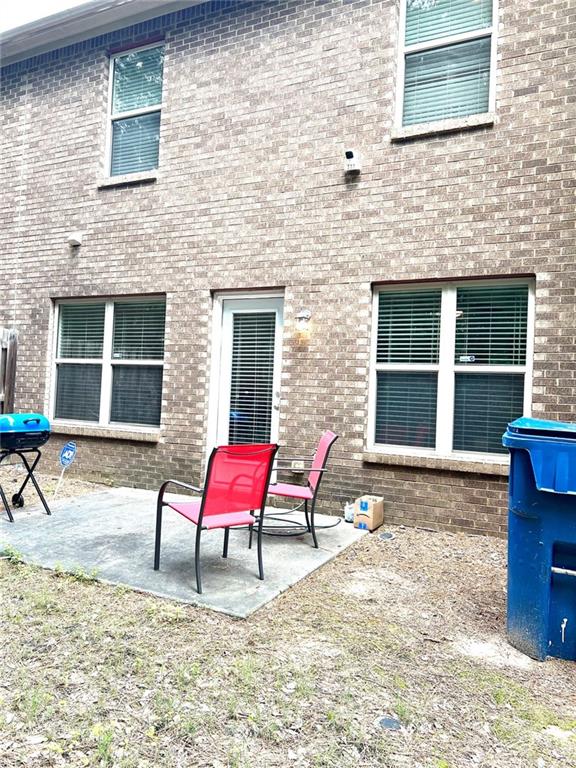 2691 Pointcrest Way, Grayson, GA 30017 - back of property with a patio and brick siding