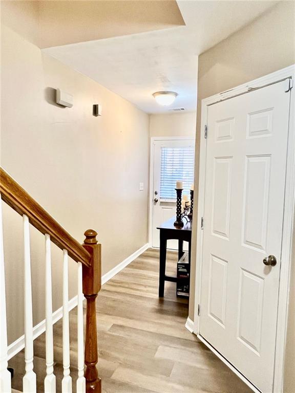 2691 Pointcrest Way, Grayson, GA 30017 - hall featuring light wood-type flooring and stairway