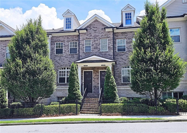 4107 Township Pkwy Unit 69, Sandy Springs, GA 30342 - view of property featuring a fenced front yard and brick siding