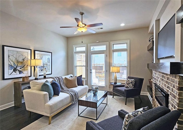 4107 Township Pkwy Unit 69, Sandy Springs, GA 30342 - living room with wood finished floors, a brick fireplace, a ceiling fan, and recessed lighting