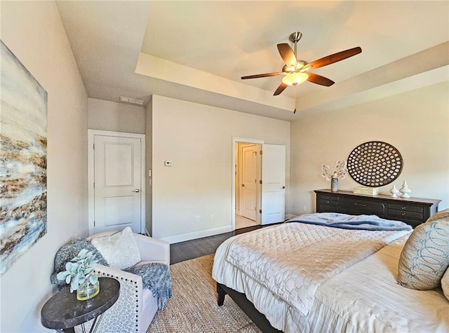 4107 Township Pkwy Unit 69, Sandy Springs, GA 30342 - bedroom with wood finished floors, a raised ceiling, and a ceiling fan