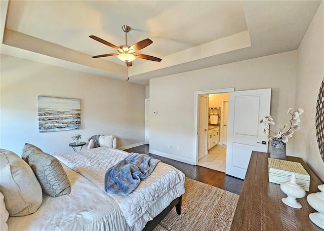 4107 Township Pkwy Unit 69, Sandy Springs, GA 30342 - bedroom featuring a raised ceiling, wood-type flooring, and a ceiling fan