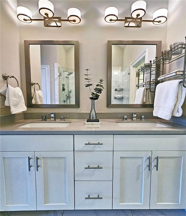 4107 Township Pkwy Unit 69, Sandy Springs, GA 30342 - full bathroom with double vanity, a stall shower, and a chandelier
