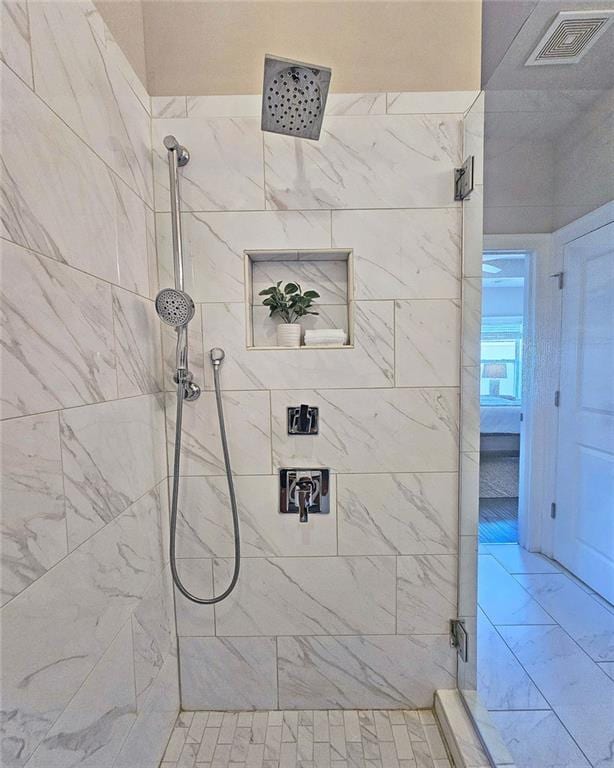 4107 Township Pkwy Unit 69, Sandy Springs, GA 30342 - bathroom with a tile shower and marble look tile flooring