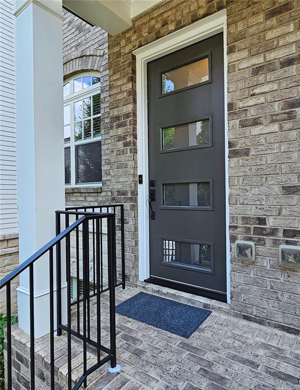 4107 Township Pkwy Unit 69, Sandy Springs, GA 30342 - view of exterior entry with stone siding and brick siding