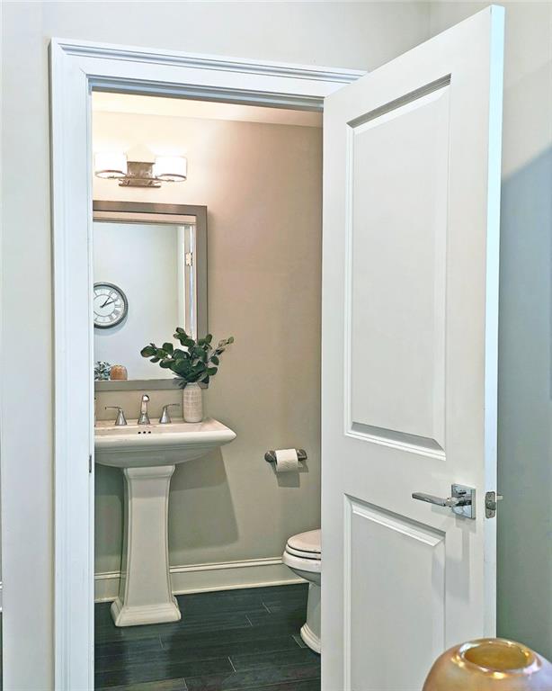 4107 Township Pkwy Unit 69, Sandy Springs, GA 30342 - half bathroom with baseboards and wood finished floors