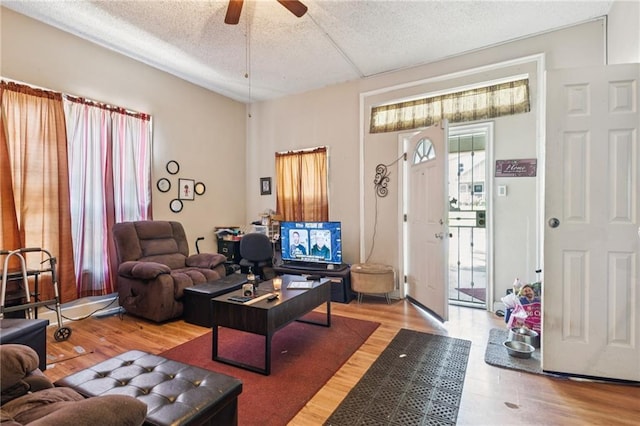 1454 Beecher St SW, Atlanta, GA 30310 - living room featuring wood finished floors, a ceiling fan, and a textured ceiling
