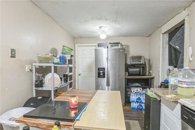 1454 Beecher St SW, Atlanta, GA 30310 - kitchen featuring stainless steel fridge, black microwave, dark wood-style flooring, a textured ceiling, and dishwasher