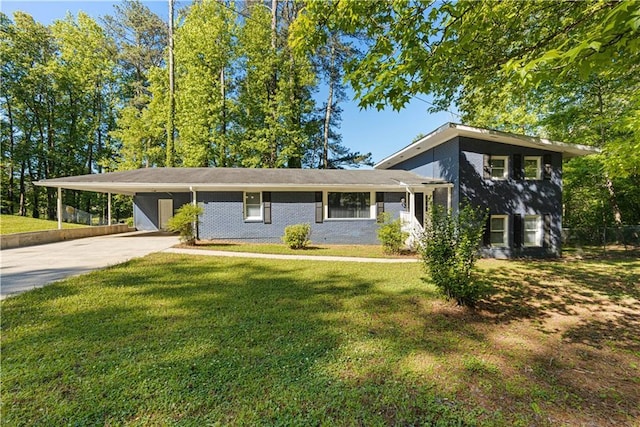 split level home featuring a carport and a front lawn