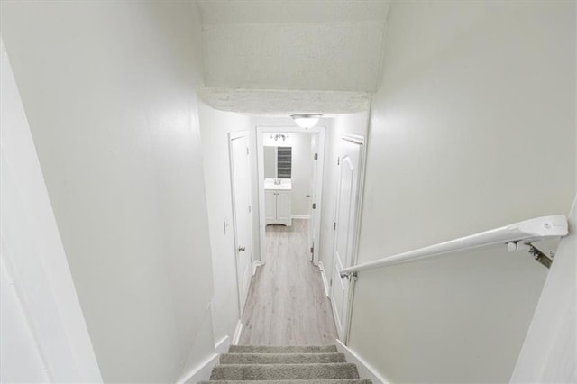 stairway featuring hardwood / wood-style floors