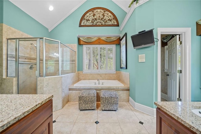 full bathroom featuring tile patterned floors, a stall shower, lofted ceiling, and a garden tub