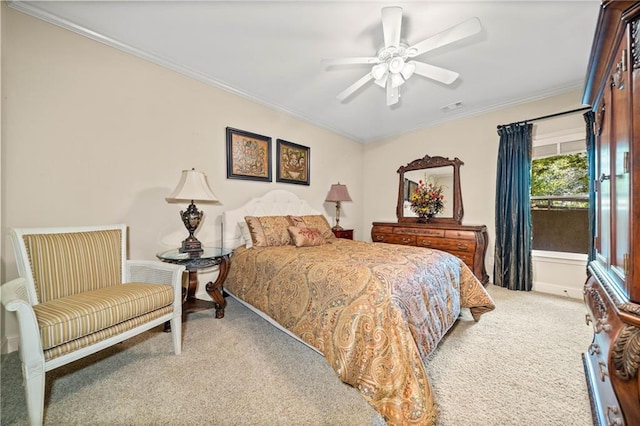 bedroom with visible vents, crown molding, ceiling fan, and carpet floors