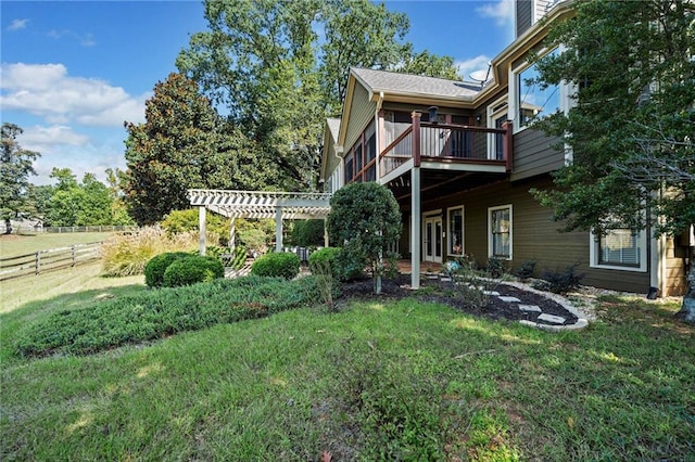 view of yard with fence, a pergola, and a wooden deck