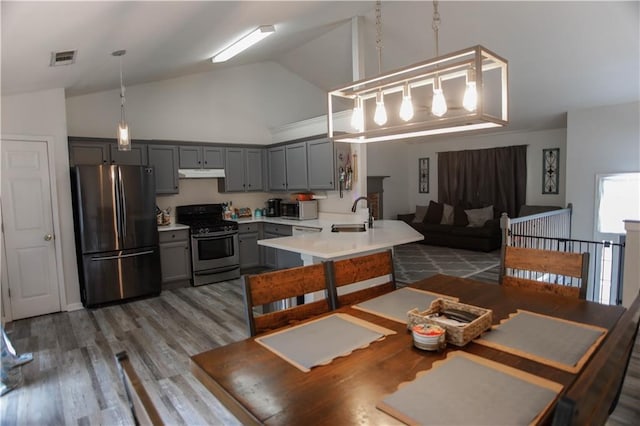 7930 River Fall Ct, Ball Ground, GA 30107 - dining space with high vaulted ceiling and wood finished floors