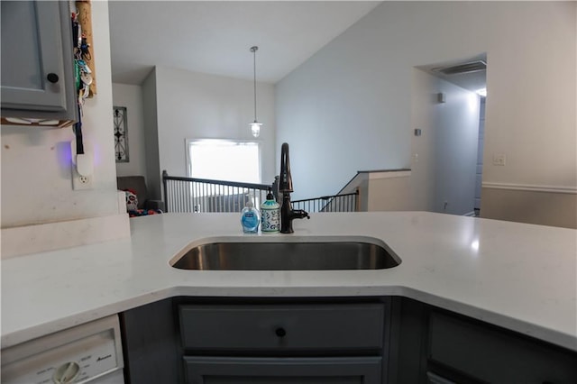 7930 River Fall Ct, Ball Ground, GA 30107 - kitchen with gray cabinets, decorative light fixtures, vaulted ceiling, and dishwashing machine