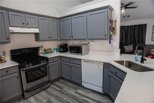 7930 River Fall Ct, Ball Ground, GA 30107 - kitchen featuring range with gas cooktop, white dishwasher, stainless steel microwave, under cabinet range hood, and gray cabinets