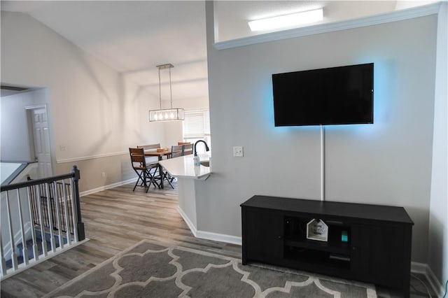 7930 River Fall Ct, Ball Ground, GA 30107 - living room with wood finished floors, lofted ceiling, and a chandelier