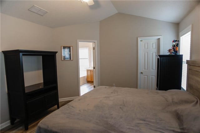 7930 River Fall Ct, Ball Ground, GA 30107 - bedroom featuring vaulted ceiling, wood finished floors, ceiling fan, and ensuite bath