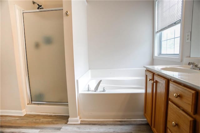 7930 River Fall Ct, Ball Ground, GA 30107 - bathroom with a shower stall, vanity, a bath, and wood finished floors