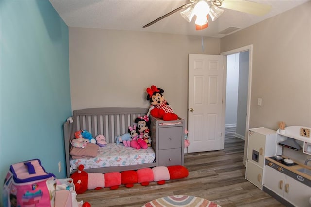 7930 River Fall Ct, Ball Ground, GA 30107 - bedroom with wood finished floors and a ceiling fan