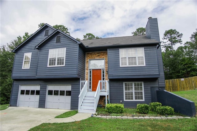 7930 River Fall Ct, Ball Ground, GA 30107 - split foyer home featuring a chimney, an attached garage, concrete driveway, and stone siding