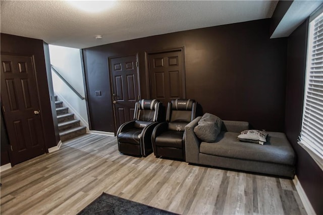 7930 River Fall Ct, Ball Ground, GA 30107 - cinema room with wood finished floors and a textured ceiling