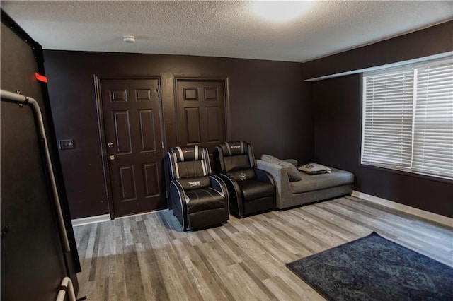 7930 River Fall Ct, Ball Ground, GA 30107 - cinema room featuring wood finished floors and a textured ceiling