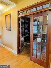 1090 Crown River Pkwy, Mcdonough, GA 30252 - doorway to outside with baseboards, wood finished floors, crown molding, and french doors