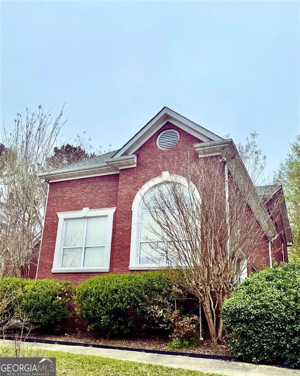 1090 Crown River Pkwy, Mcdonough, GA 30252 - view of side of home with brick siding