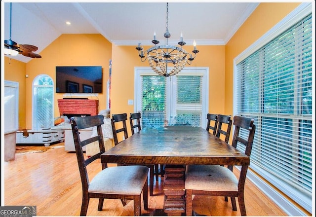 1090 Crown River Pkwy, Mcdonough, GA 30252 - dining room featuring a chandelier, plenty of natural light, wood finished floors, and crown molding