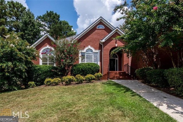 1090 Crown River Pkwy, Mcdonough, GA 30252 - view of front of home with brick siding and a front yard