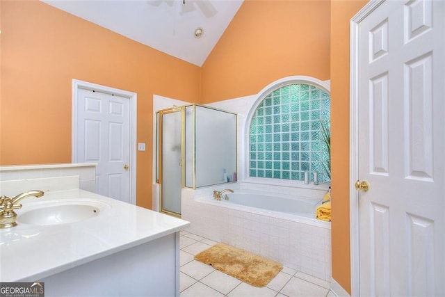 1090 Crown River Pkwy, Mcdonough, GA 30252 - full bath featuring a stall shower, tile patterned flooring, a garden tub, high vaulted ceiling, and vanity