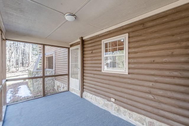 unfurnished sunroom featuring a healthy amount of sunlight