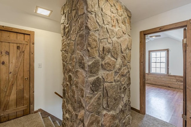 corridor featuring vaulted ceiling