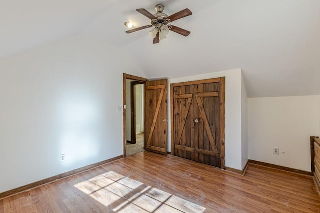 additional living space featuring lofted ceiling, ceiling fan, and light hardwood / wood-style floors