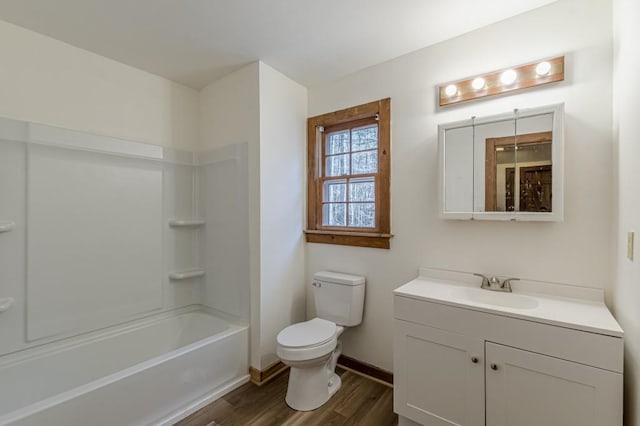 full bathroom with toilet, hardwood / wood-style flooring, shower / bathing tub combination, and vanity