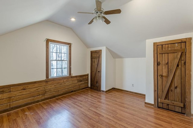 bonus room featuring ceiling fan, vaulted ceiling, and light hardwood / wood-style flooring