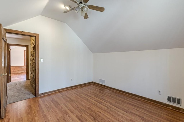 bonus room with lofted ceiling, ceiling fan, and hardwood / wood-style floors