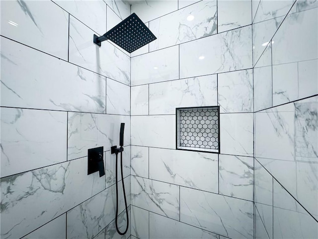 room details with a tile shower