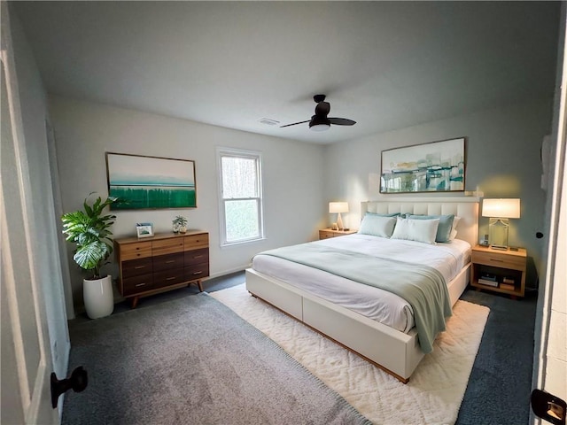 bedroom with ceiling fan and light colored carpet