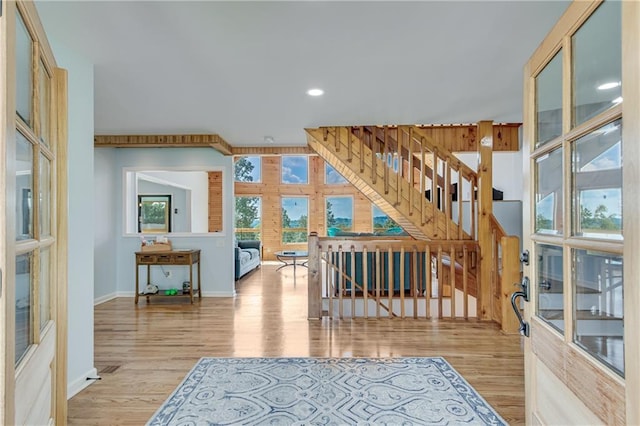 interior space featuring stairs, recessed lighting, wood finished floors, and baseboards