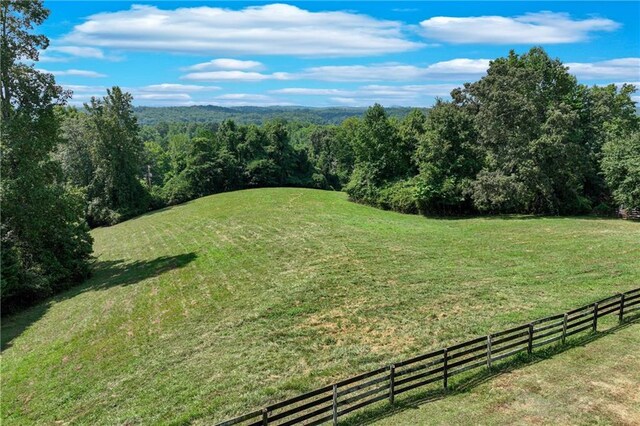 view of yard with a rural view