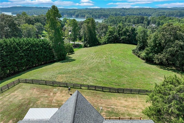 birds eye view of property featuring a rural view and a water view